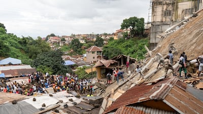 Rescuers dig for survivors in the rubble of a collapsed building collapse in Freetown, Sierra Leone. EPA