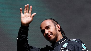 Mercedes' British driver Lewis Hamilton waves as he arrives for the podium ceremony after the Formula One Belgian Grand Prix at the Spa-Francorchamps Circuit in Spa on July 28, 2024.  (Photo by SIMON WOHLFAHRT  /  AFP)