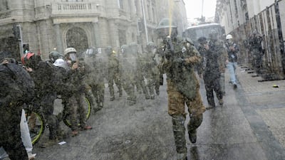 Chilean security forces at a rally ahead of the 51st anniversary of the 1973 military coup, in Santiago. Reuters