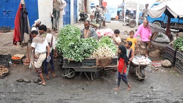 Vendors sell vegetables after heavy floods in the Hays region of Yemen's Hodeidah province. AFP