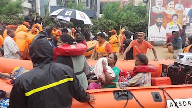 Rescue teams help people to safety in the city of Vijayawada.  Andhra Pradesh Police