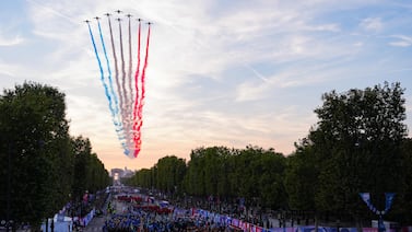 French Air Force Elite acrobatic flying team performs as athletes arrives on the Champs-Elysees during the Paris 2024 Paralympic Games opening ceremony on August 28. AFP