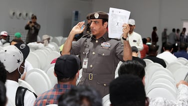 Officials helping violators during the second day of visa amnesty at the General Directorate of Residency and Foreigners Affairs Dubai in Al Awir area in Dubai. Pawan Singh / The National
