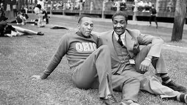Jesse Owens, left, at the 1936 Olympics in Berlin wearing Dassler shoes made by the two brothers who would eventually form adidas and Puma. AP