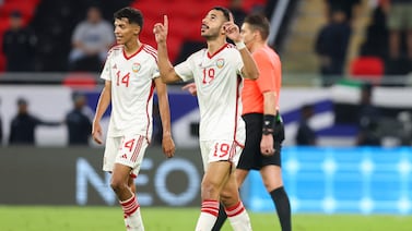UAE's defender #04 Kouame Kouadio celebrates after scoring his team's second goal during the FIFA World Cup 2026 Asia zone qualifiers football match between Qatar and the United Arab Emirates at the Ahmad Bin Ali Stadium on September 5, 2024.  (Photo by Karim JAAFAR  /  AFP)