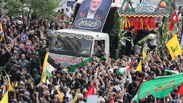 People gather around a truck carrying the coffins of Hamas late political leader Ismail Haniyeh and his bodyguard, during a funeral procession in Tehran, Iran, 01 August 2024.  EPA.