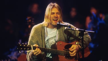 Kurt Cobain of Nirvana during the taping of MTV Unplugged in New York City in1993. His cardigan later sold at auction for $334,000, despite being full of holes. Photo by Frank Micelotta.