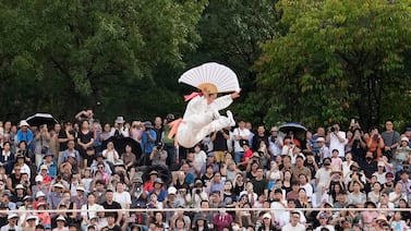 South Korean tightrope walker Seo Joo Hyang performs "Jultagi," or Tightrope Walking, to celebrate the Chuseok, the Korean version of Thanksgiving Day, at the Namsan Hanok village in Seoul, South Korea, Tuesday, Sept.  17, 2024.  (AP Photo / Ahn Young-joon)