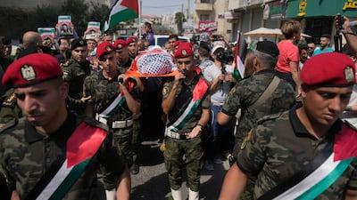 A Palestinian honour guard carries the body of Aysenur Ezgi Eygi, 26, who was fatally shot by Israeli soldiers during an anti-settlement protest in the occupied West Bank, during a funeral procession in Nablus. AP