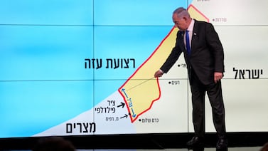 Israeli Prime Minister Benjamin Netanyahu stands before a map of the Gaza Strip, telling viewers that Israel must retain control over the Salah Al Din corridor, on September 2, 2024. Reuters
