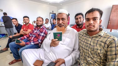 Bangladeshi citizens attend their country's embassy in Abu Dhabi to make plans to settle their residency status ahead of a two-month visa amnesty starting on Sunday, September 1. Victor Besa / The National