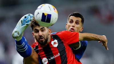 Al Hilal's Joao Cancelo, right, in action with Al Rayyan's Hazem Shehata. Reuters
