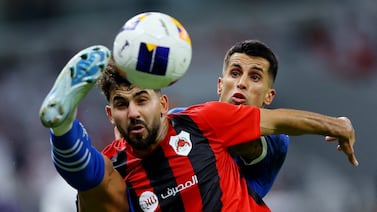 Al Hilal's Joao Cancelo, right, in action with Al Rayyan's Hazem Shehata. Reuters