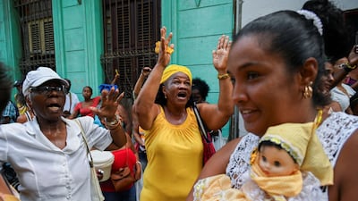 Followers of the Virgin of Charity, Oxun in the Yoruba religion, take part in a procession in Havana, Cuba. AFP