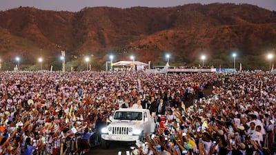 Pope Francis greets followers from a car after leading a holy mass in Dili, East Timor. Reuters