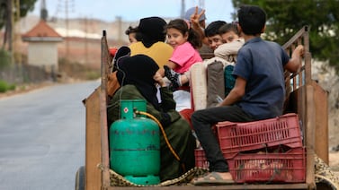 Syrian refugees leave Wazzani village, southern Lebanon on Sunday. People uprooted by war often fall between the gaps created by red tape, government policies and changing rules. EPA