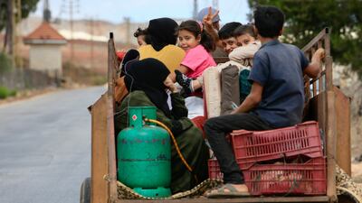 Syrian refugees leave Wazzani village, southern Lebanon on Sunday. People uprooted by war often fall between the gaps created by red tape, government policies and changing rules. EPA