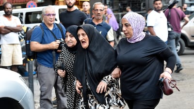 Friends and relatives of injured people arrive at the American University of Beirut Medical Centre. EPA