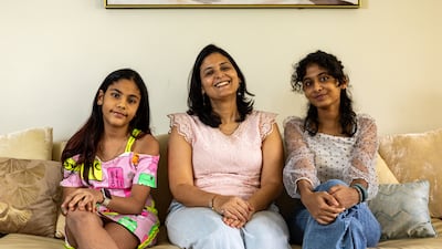 Shraddha Bhandari, centre, with her daughters Kaya, 9, left, and Viha, 13, at their home