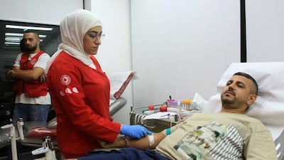 A man donates blood in the southern Lebanese city of Saida after a wave of injuries and fatalities in pager explosions. AFP